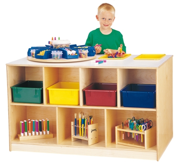 child smiling while using full storage unit
